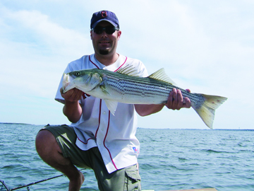 Kevin scores a striper in Casco Bay, Maine