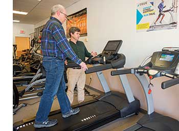 Testing out a treadmill at Workout Fitness Store