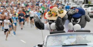 Slugger and his Mom lead the way on the flat 5K course which begins in front of the Portland Expo building.
