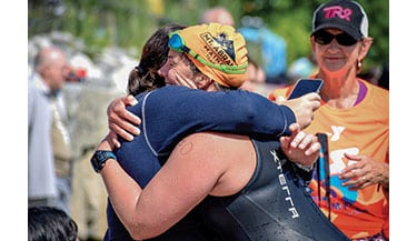 Swimmers brave cold and strong currents to complete the Peaks to Portland Swimfor Kids and raise money for YMCA youth programs. Photo courtesy YMCA of Southern Maine
